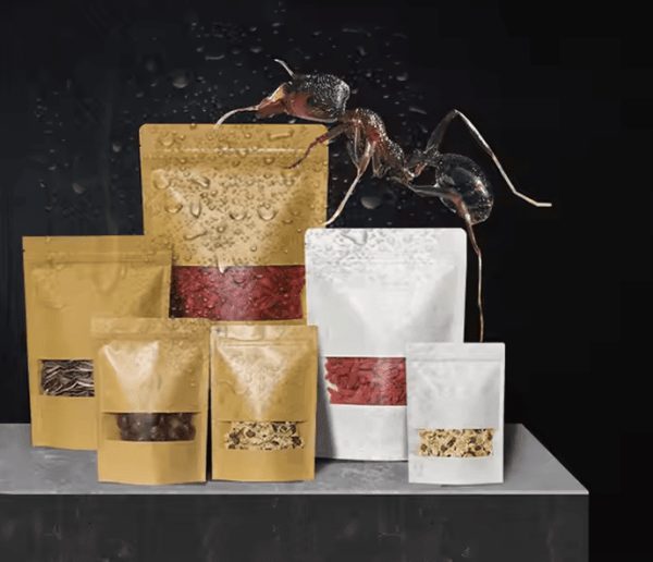 Multiple packaging bags containing dried ingredients with an ant on one of the bags.